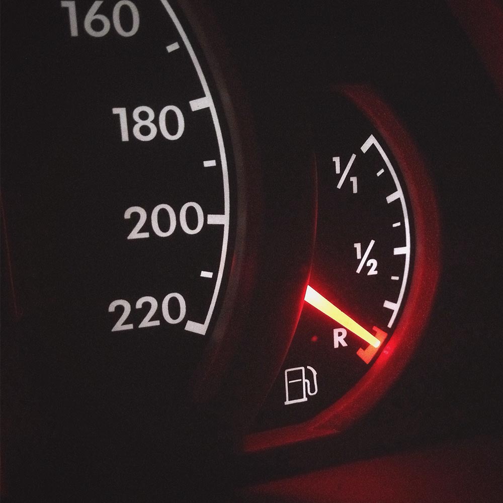 A closeup image of a fuel dial in a vehicle.